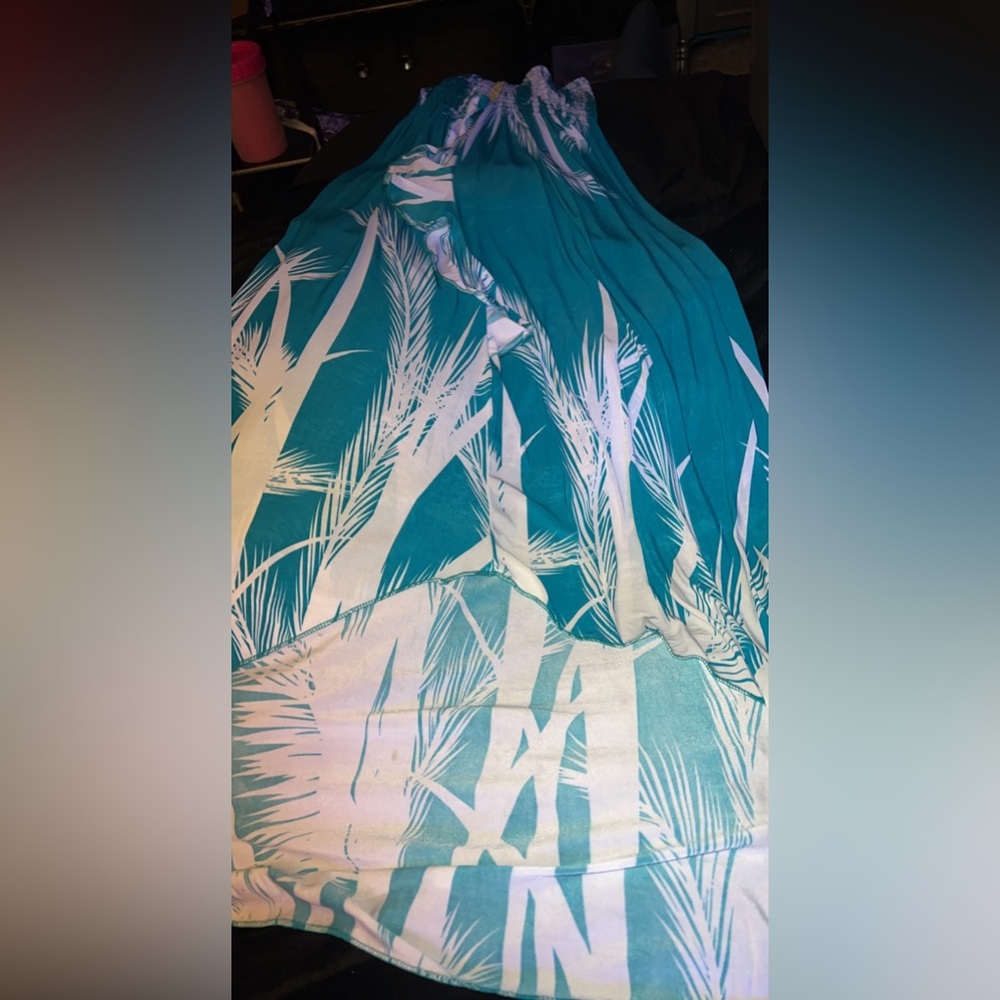 New. Has a v in front at bottom with ruffle down to V